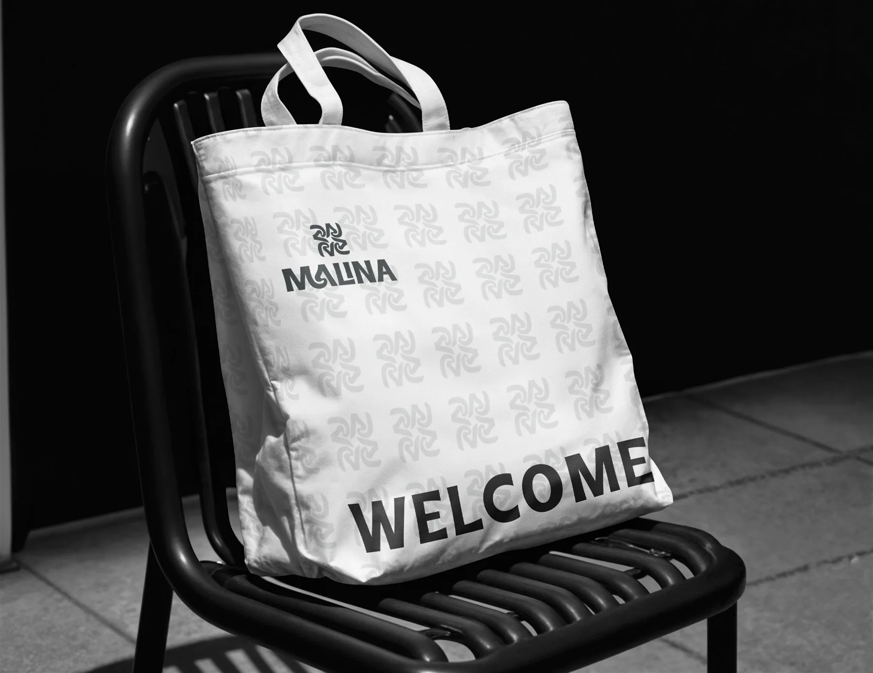 Malina tote bag resting on a chair